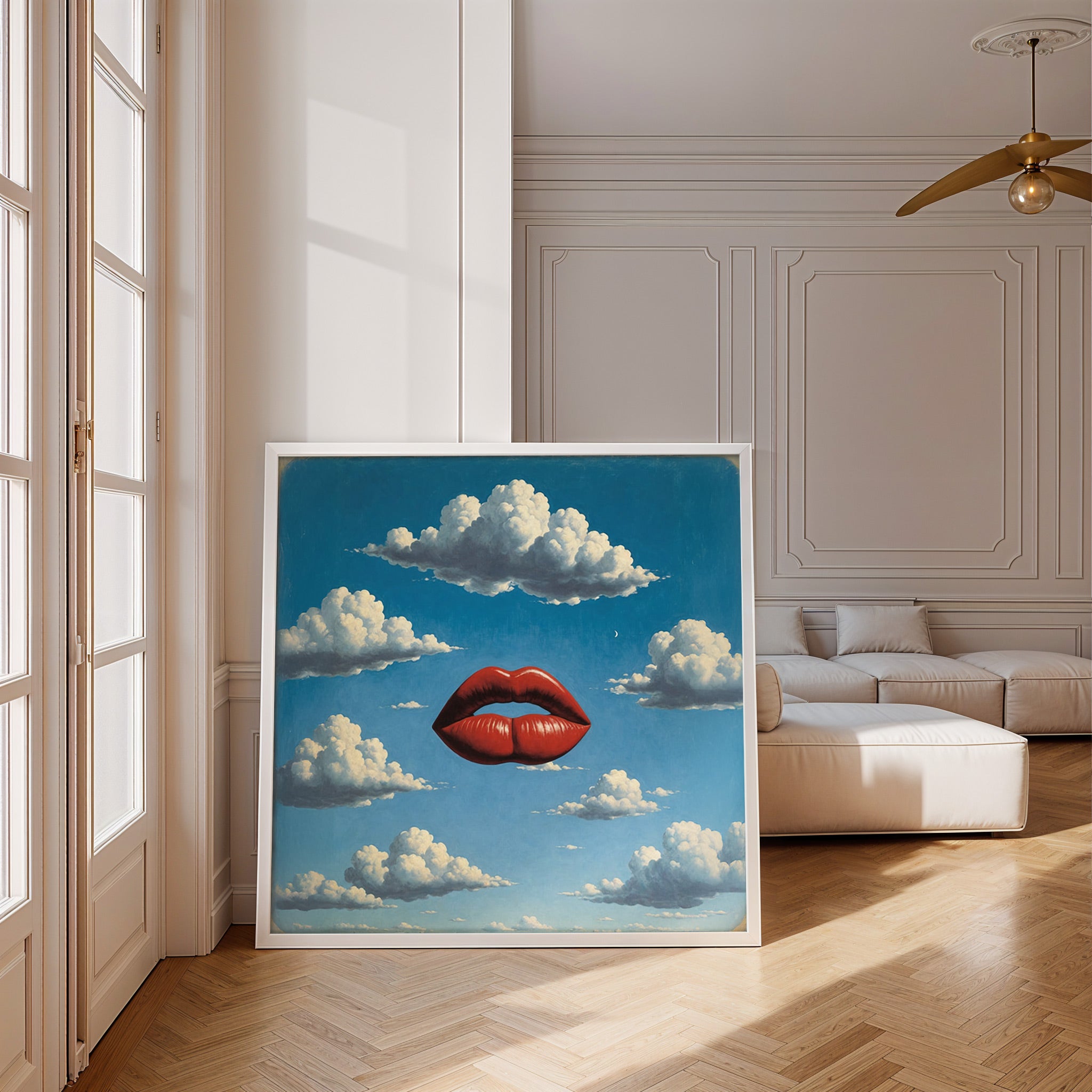 Framed artwork of a red lip against a blue sky with clouds in a modern living room.